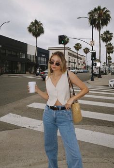 Discover the perfect LA outfits for every activity under the sun in our latest blog post. From breezy beachwear to chic city looks, we've got your packing list covered with stylish ensembles suited for brunching, sightseeing, and everything in between. Get ready to strut the streets of Los Angeles in style! Outfit Ideas | Lo Angeles Aesthetic | LA Outfit | LA Vacation Outfits | LA Street Style | LA Honeymoon | LA Fashion Street | LA Trips | LA Travel | LA Shopping | LA Inspo | LA Attractions La Ootd Summer Outfits, Summer Los Angeles Outfits, 90s Inspired High Waist Jeans For Summer, 90s Inspired Light Wash Jeans For Summer, Mom Jeans Summer Outfit, Summer Mom Jeans Outfit, Everyday Rigid Denim Jeans For Summer, Los Angeles Instagram Pictures, La Style Outfits