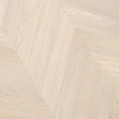 an image of wood flooring that looks like herringbones or chevron lines