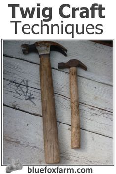 two old wooden hammers sitting next to each other on top of a white table