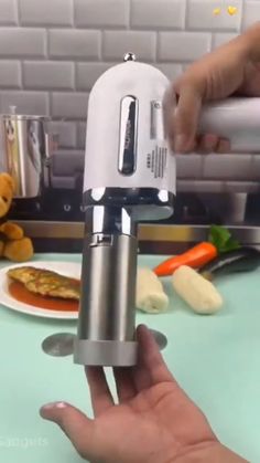 a person is using a hand blender to make food