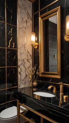 a bathroom with black marble and gold fixtures