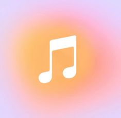 a music note is shown in the middle of an orange and pink blurry background