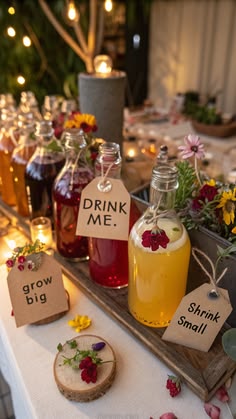 a table topped with jars filled with liquid and flowers