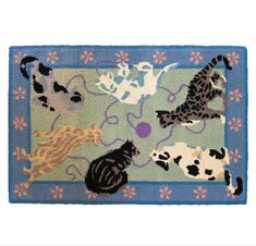 a rug with cats and dogs on it