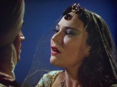 an image of a woman that is talking to another woman who is wearing a tiara