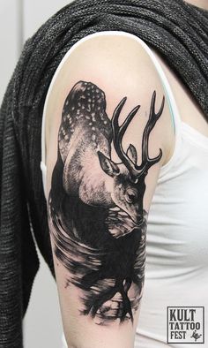 a woman with a deer tattoo on her arm