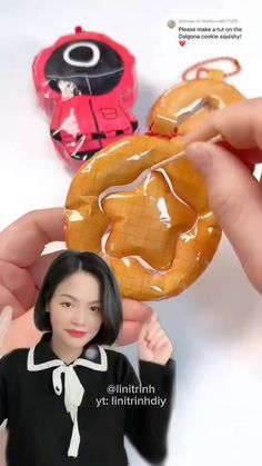 a woman holding up a donut in front of two other people's hands
