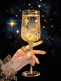 a hand holding a wine glass in front of stars
