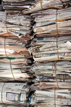 a large stack of newspapers stacked on top of each other