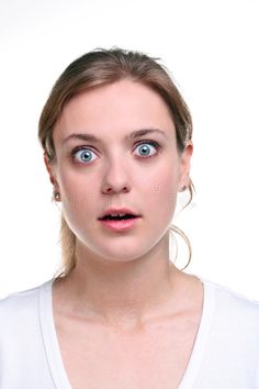 a woman making a face with her eyes wide open