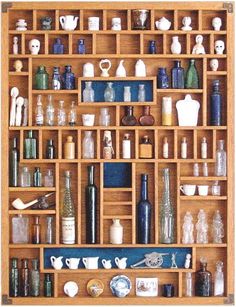 a wooden shelf filled with lots of bottles