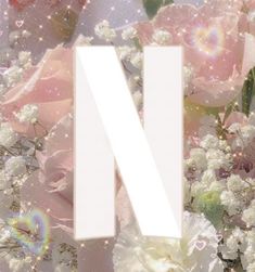 the letter n is surrounded by flowers and sparkles