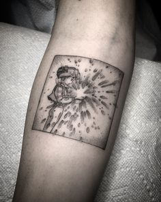 a tattoo on the arm of a person with a star burst in it's center