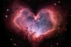 a heart shaped object in the middle of space