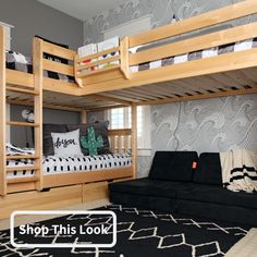 a room with bunk beds and a black rug