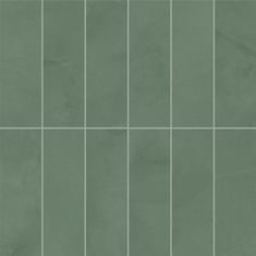 a green tile wall with squares and lines