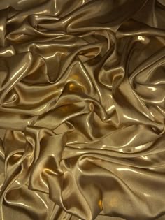a close up view of a shiny gold cloth