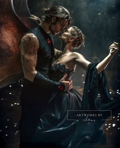 a man and woman are kissing in front of an image of a dragon's wings