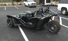 an electric car is parked in a parking lot