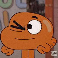 an orange cartoon character holding his hand up to his face and looking at the camera