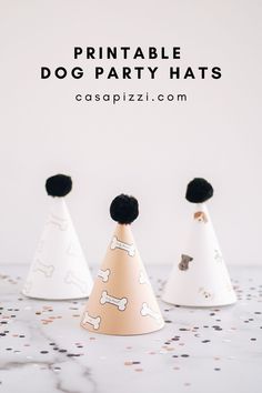 three party hats with black pom poms on them and the words printable dog party hats