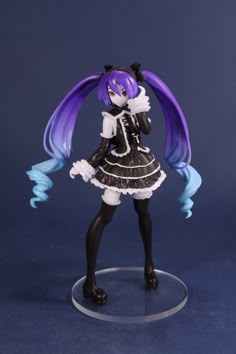 a figurine with purple hair and blue eyes