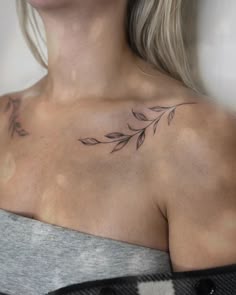 a woman with a tattoo on her chest