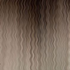 an abstract photo of wavy lines on a wall