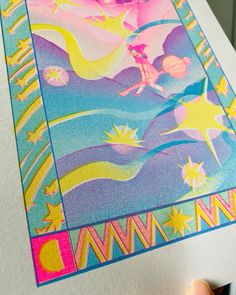 someone is holding up a drawing with colored pencils on the paper and it looks like they are going to paint