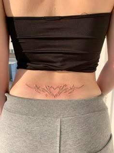 a woman with a tattoo on her stomach