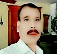 a man with a moustache on his face