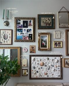 a living room wall covered in pictures and framed art on it's side walls