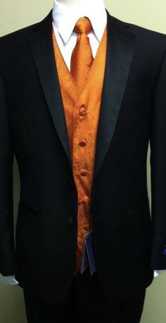 Black And Orange Wedding Suit, Black Suit With Burnt Orange Accents, Black And Orange Tuxedo, Black Orange Wedding, Black And Orange Fall Wedding, Black Suit With Orange Accents, Black Tux With Orange Vest, Black Suit Orange Tie Groomsmen, Black And Orange Groomsmen