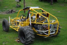 an off road vehicle parked in the grass