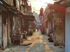 an alley way with lots of old buildings and people walking down the street at sunset