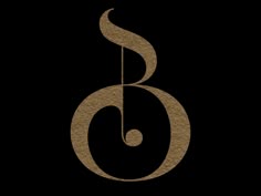 the letter b is made out of brown paper and has a musical note on it