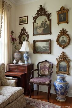 a living room filled with furniture and pictures on the wall
