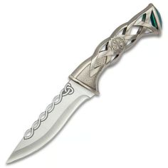 a knife with an intricate design on the blade