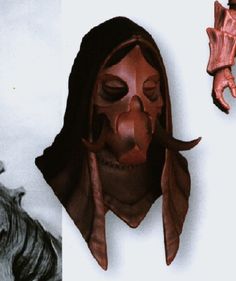 two different images of people with masks on their faces and hands, one in the shape of a human head