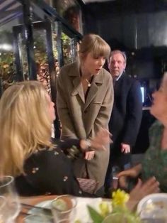 a group of people sitting around a table