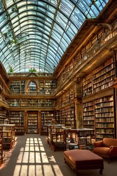 a large library filled with lots of books under a glass ceiling covered in light pouring through the windows