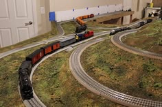 a model train set is shown on the tracks