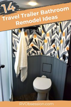 the bathroom is decorated in gray and orange with floral wallpaper on the walls, along with a white toilet