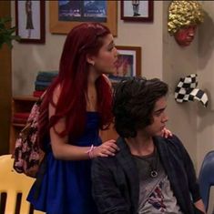 the young man and woman are talking to each other