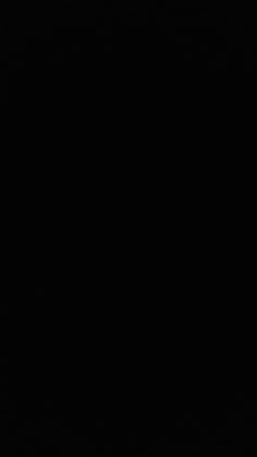 an airplane is flying in the sky at night