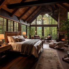 a large bed sitting inside of a bedroom next to a fire place in a living room