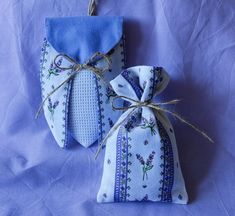 two small bags with ties tied to them