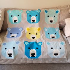 a teddy bear themed blanket on top of a couch