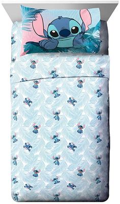 the little mermaid bedding set is blue and has an adorable cartoon character on it