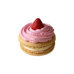 a close up of a pastry with frosting and a strawberry on top